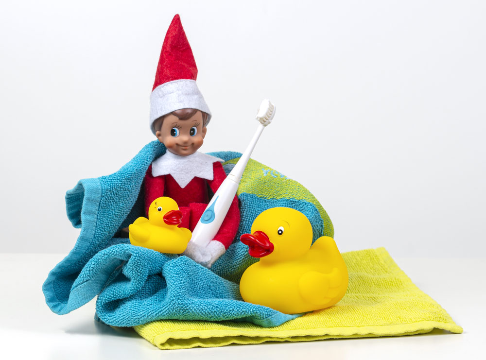 elf on the shelf with a toothbrush