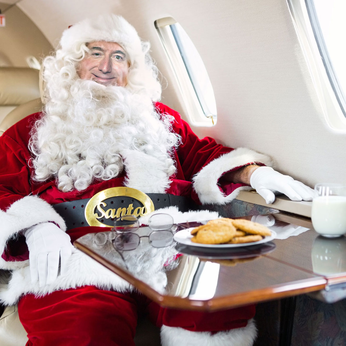 Jeff Bezos as Santa, Patron Saint of Capitalism, on the Amazon sled