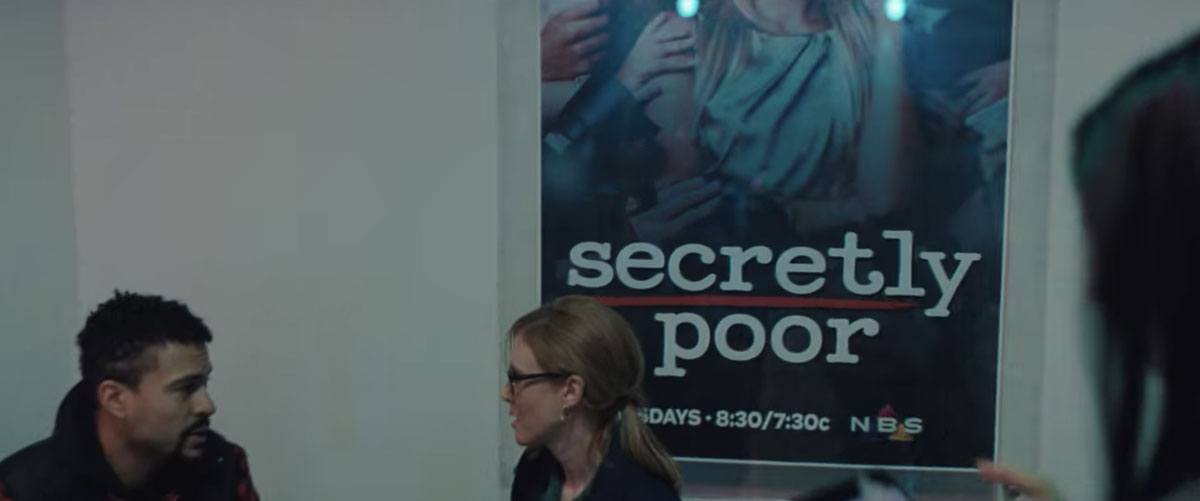 A poster for "Secretly Poor" on NBS where The Daily Rip films in Don't Look Up