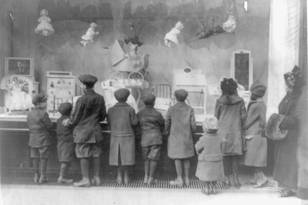 Children looking into store windows early 20th century