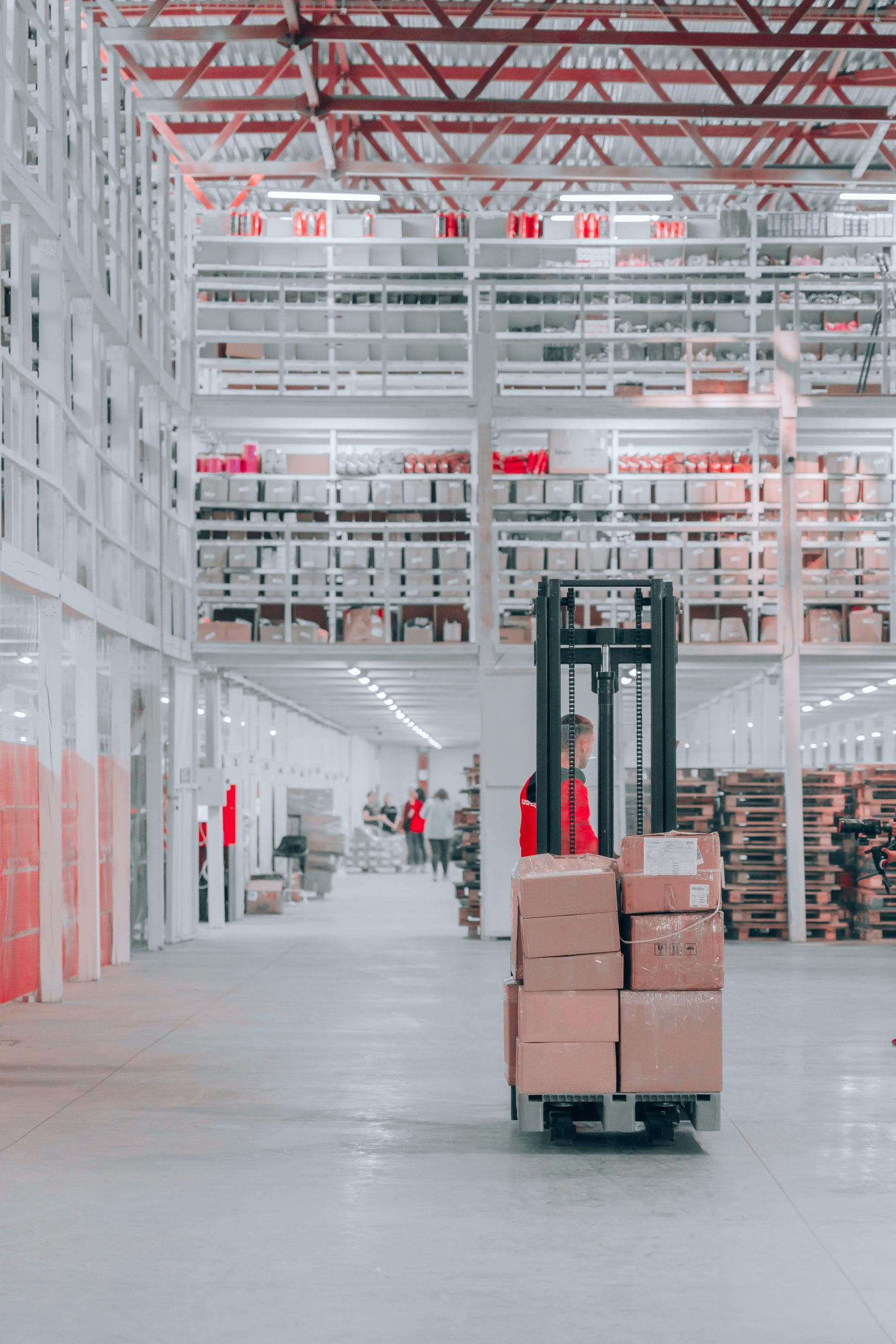 A person packing dropshipping boxes in a warehouse