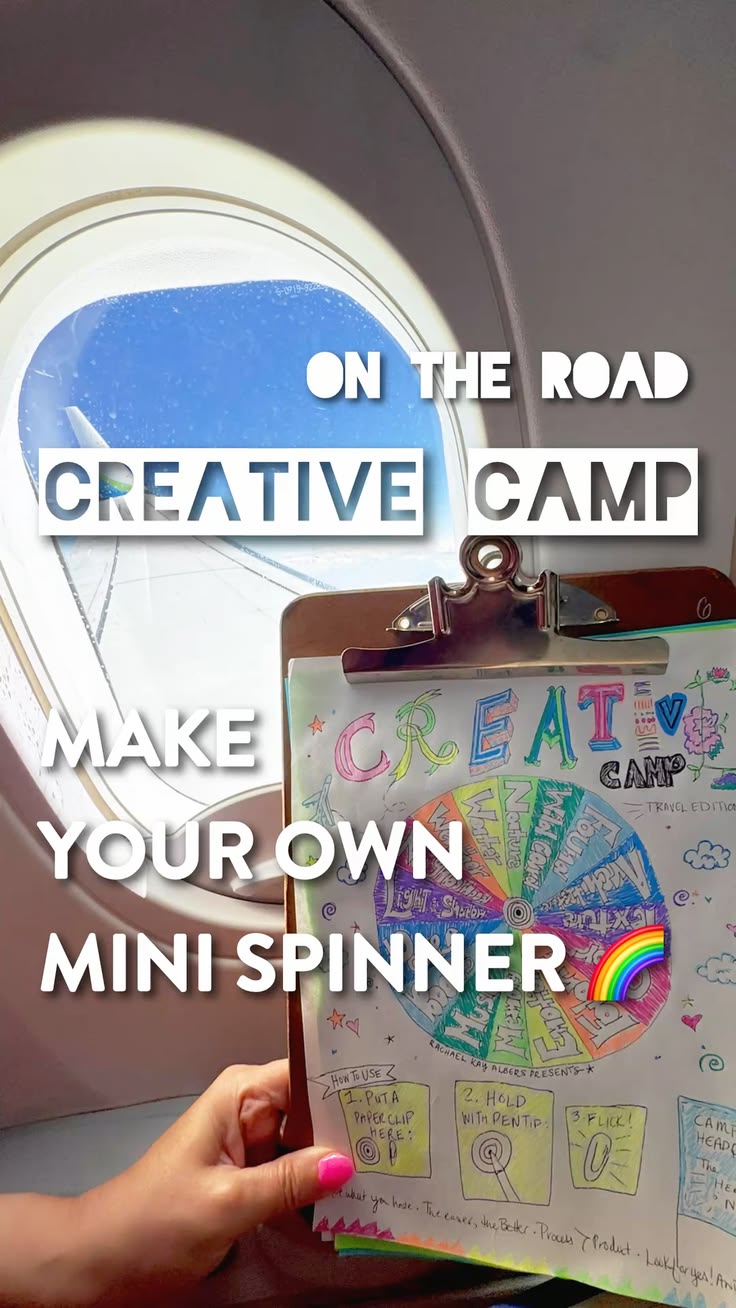 Creative Camp clipboard on board a plane looking out window