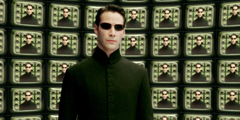 Keanu Reeves in front of wall of screens with his face: deepfake apologist?