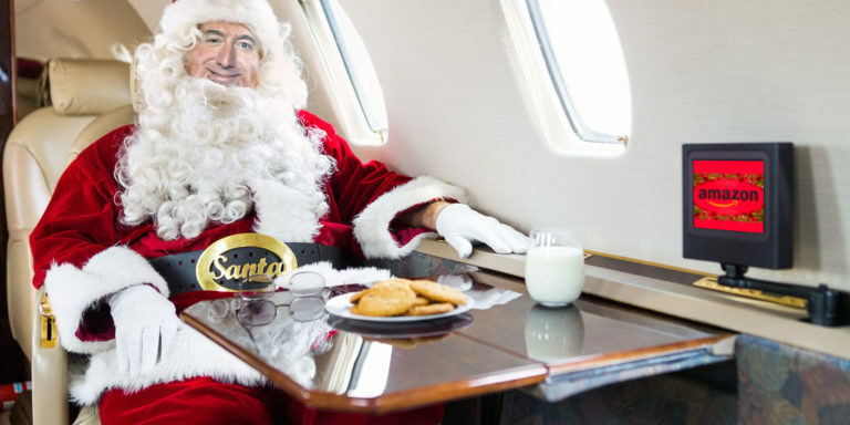 Santa, Patron Saint of Capitalism: Jeff Bezos in Santa Suit in private jet